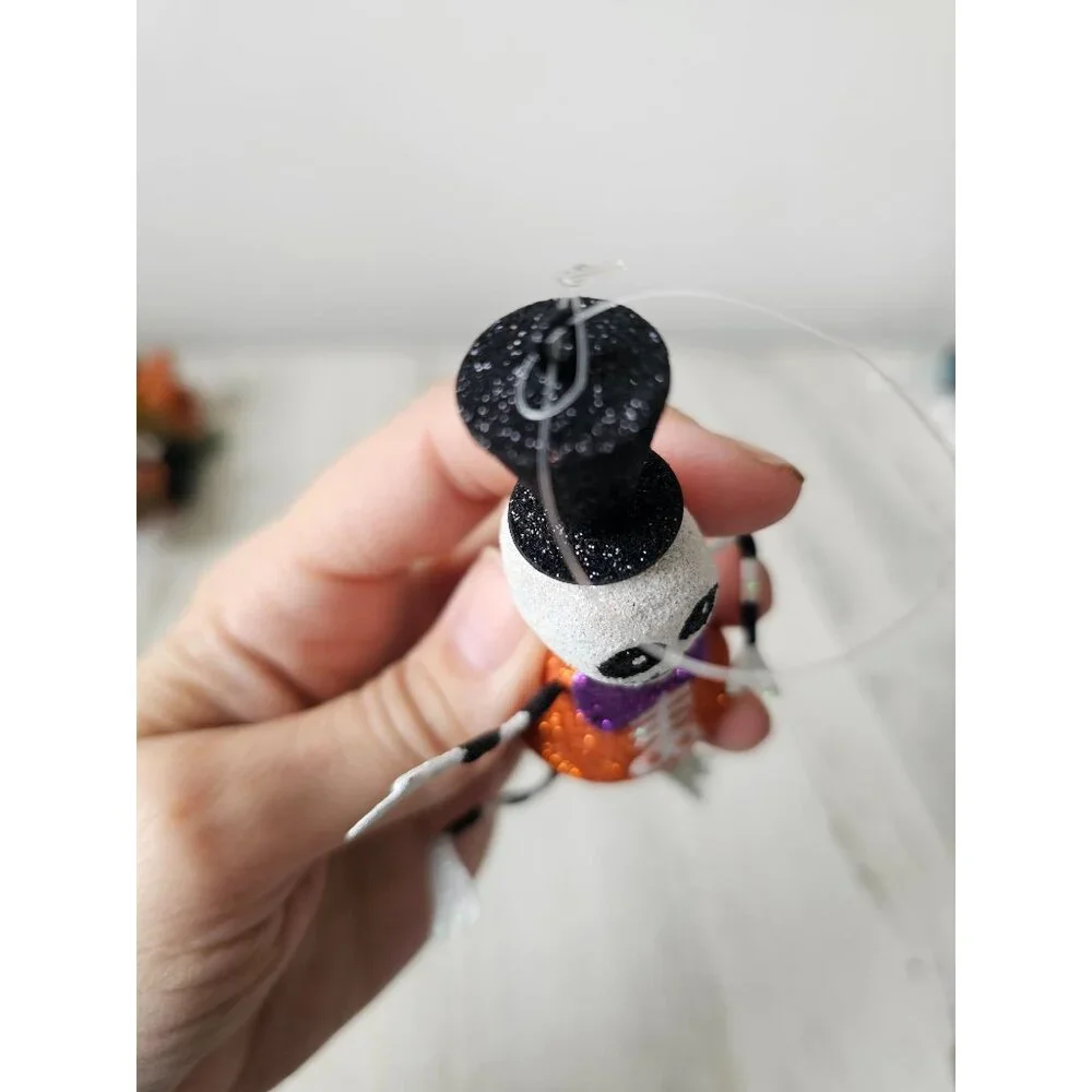 Pier 1 skeleton glitter ornament bow tie top hat Halloween Xmas tree black and w